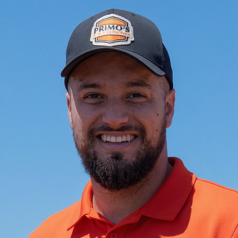 Smiling man wearing a cap
